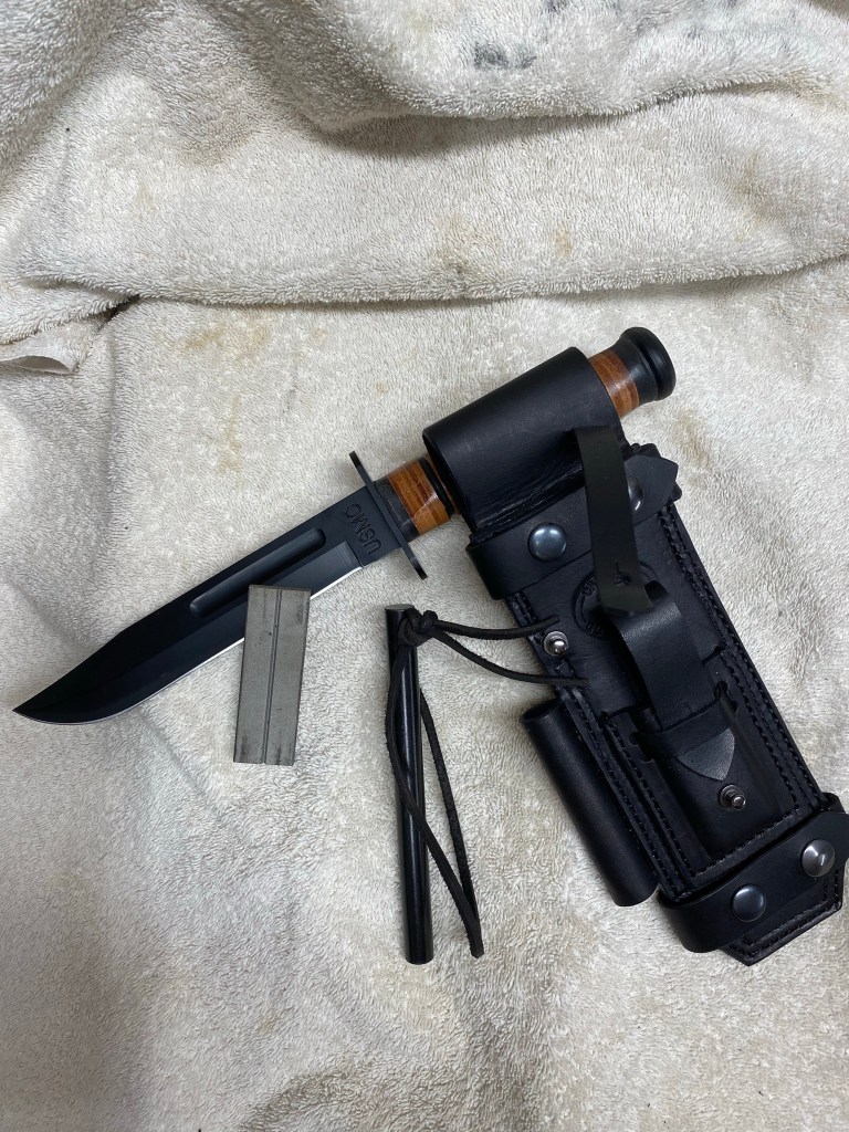 Sheath with sharpener and ferro rod. Knife NOT included